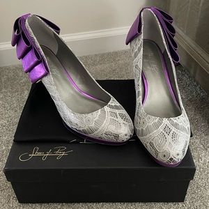 Silver heel w/white lace, purple trim & bow on the back. Extremely comfortable.